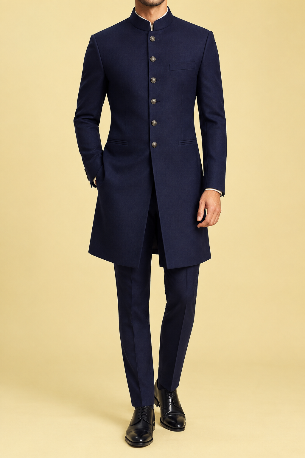 Man wearing a midnight navy prince suit with long fitted coat and mandarin collar by HOUSE of KAZI